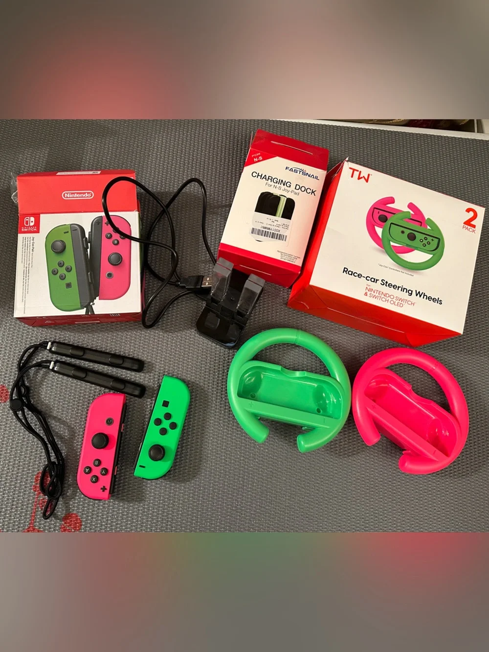 2 Nintendo switch Joy-Con Controllers 2 Racing steering wheels & 1 charging dock